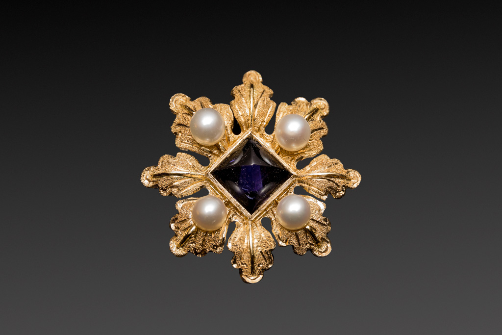 Florence, Penko Bottega Orafa (goldsmith workshop): golden brooch repeating the model of one of the Charites depicted in the Botticelli's Primavera. This is a classical example of Renaissance florentine jewel. The jewel is enriched by four pearls and a iolite, symbol of force and purity.